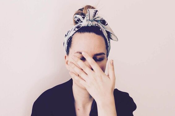 Woman touching her face