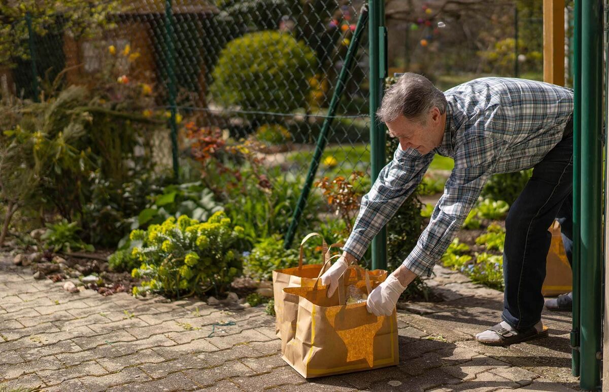 man getting food delivery during covid-19