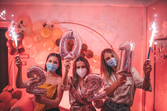 Happy friends celebrate the New Year 2021