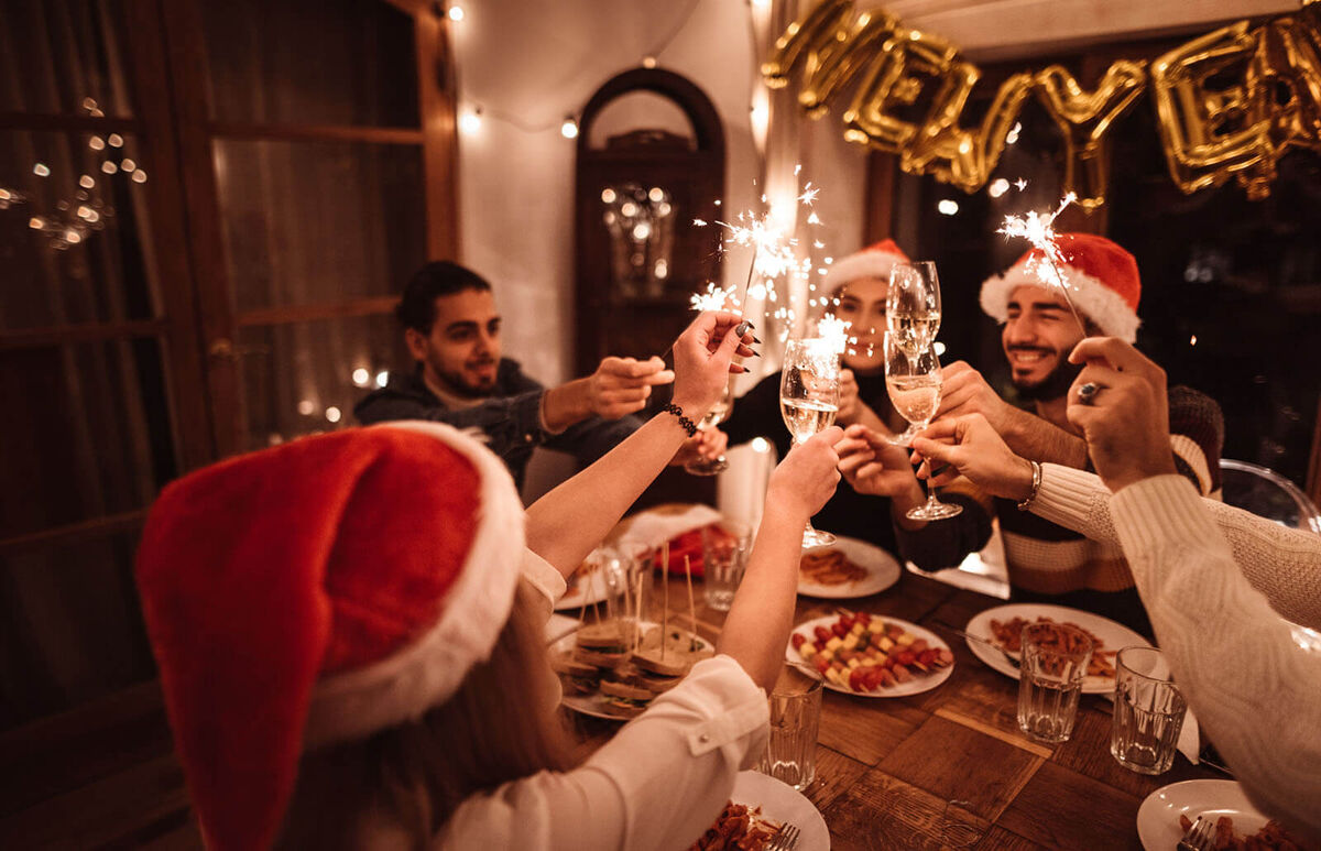 friends toasting at home for new year